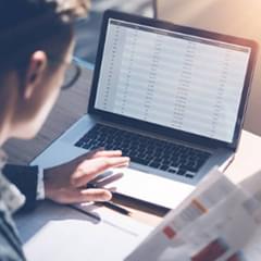 Person typing on a laptop computer