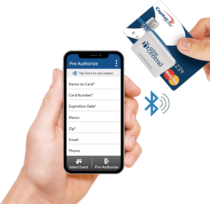 Hand holding a smartphone with a mobile card reader, processing a credit card