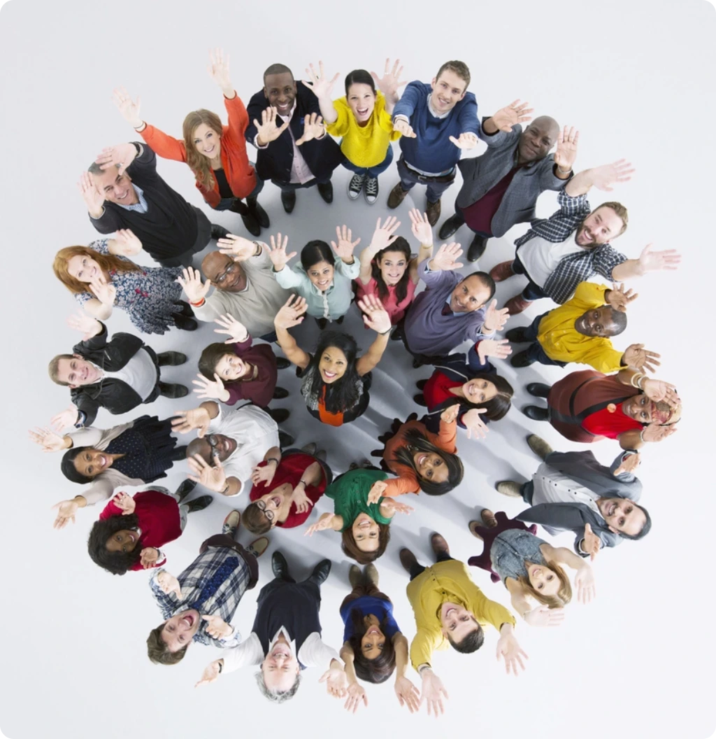 A group of people showing their hands towards the sky